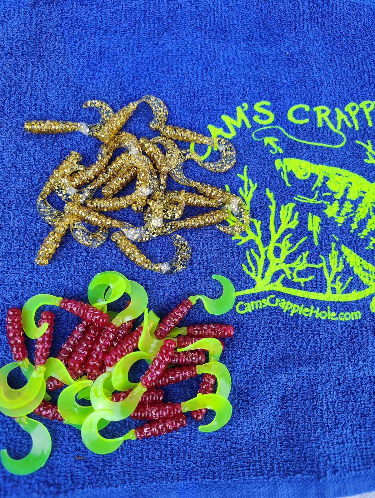 Cam's Mr October Gold and Fireball Red hand-poured curly tail crappie soft plastics