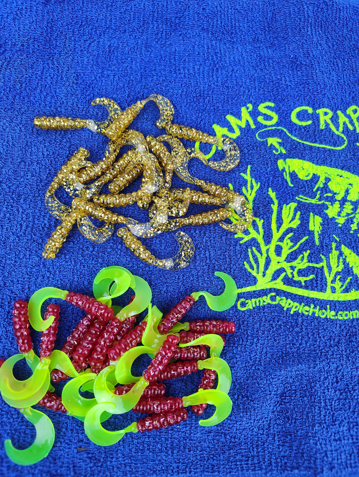 Cam's Mr October Gold and Fireball Red hand-poured curly tail crappie soft plastics
