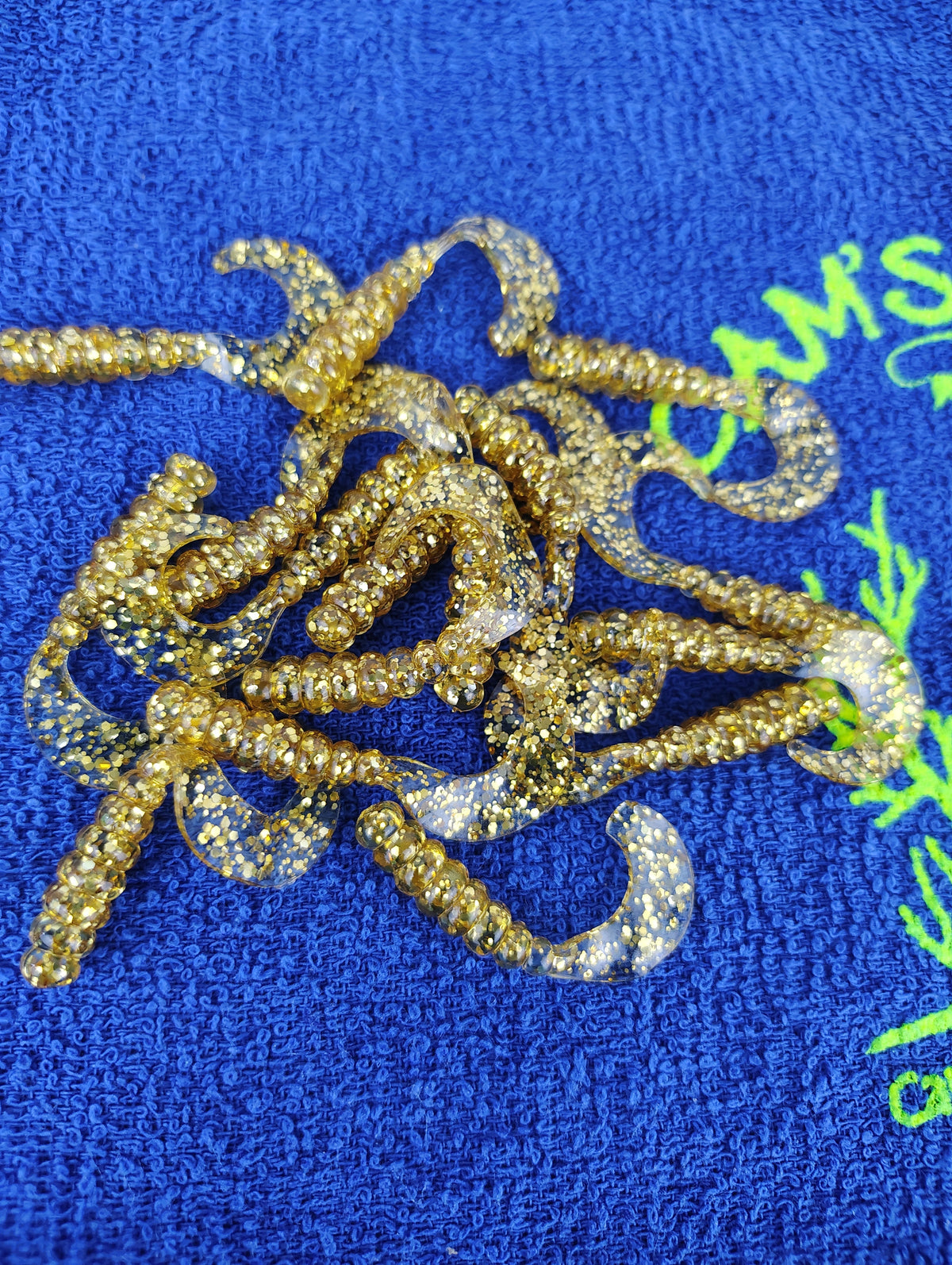 Cam's 2" Hologram Flake Curly Tail Crappie Jigs – Mr October Gold / Fireball Red 100pc Split Set
