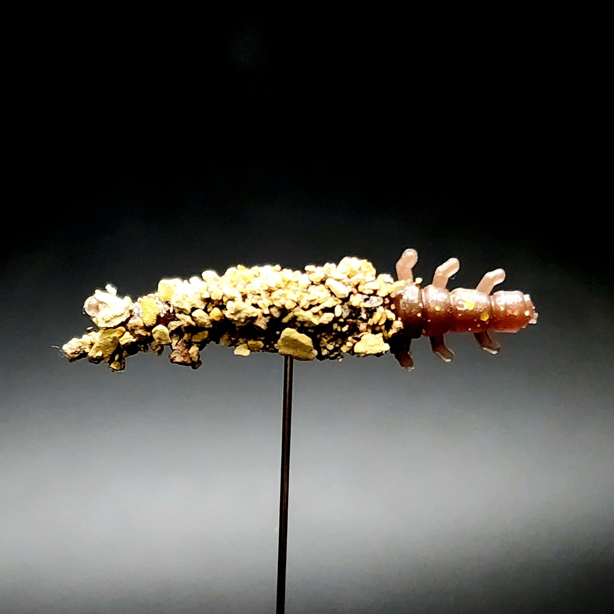 Realistic trout bait designed to imitate caddis fly larvae