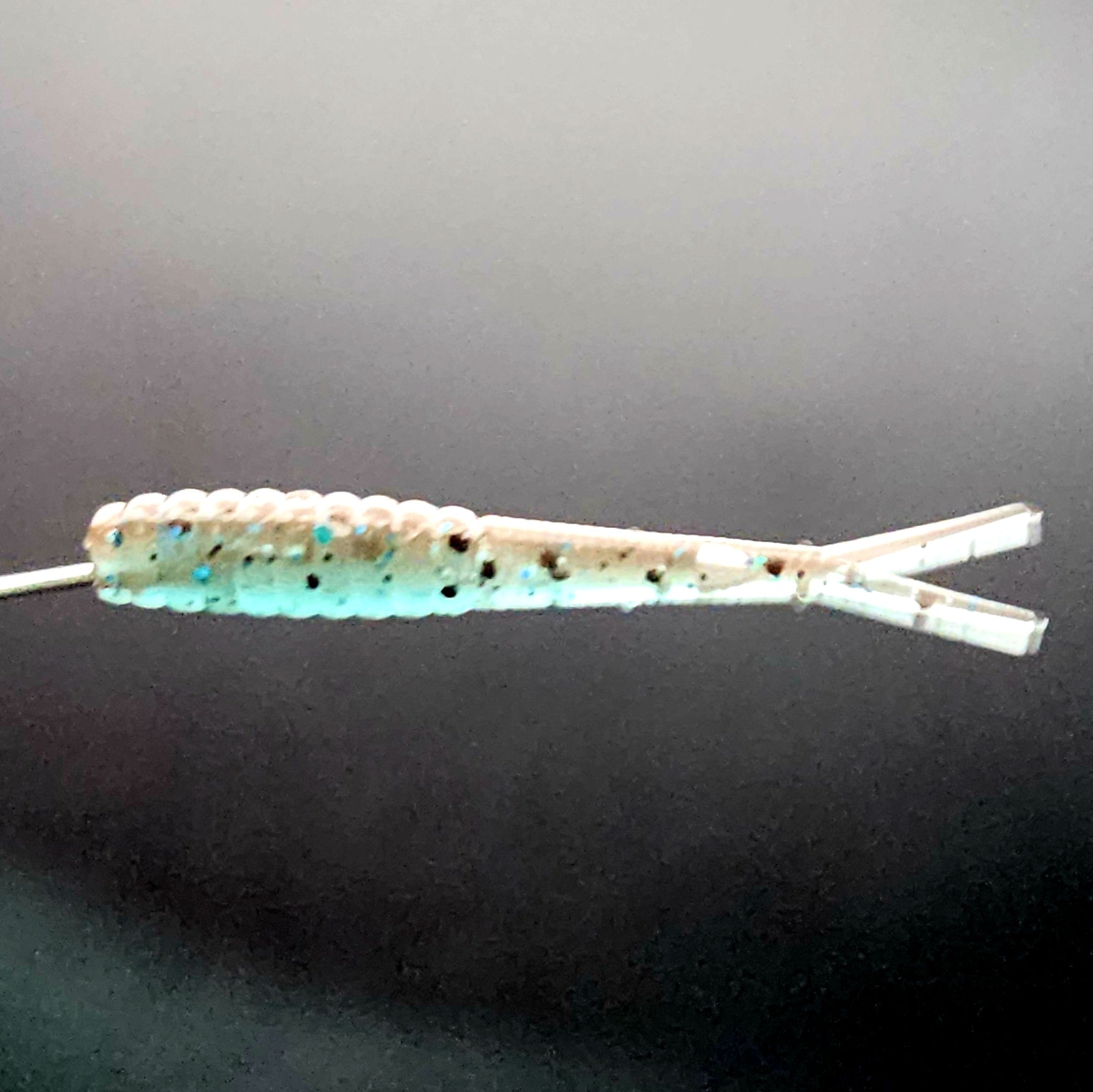 Floating micro fluke bait rigged on tungsten jig head