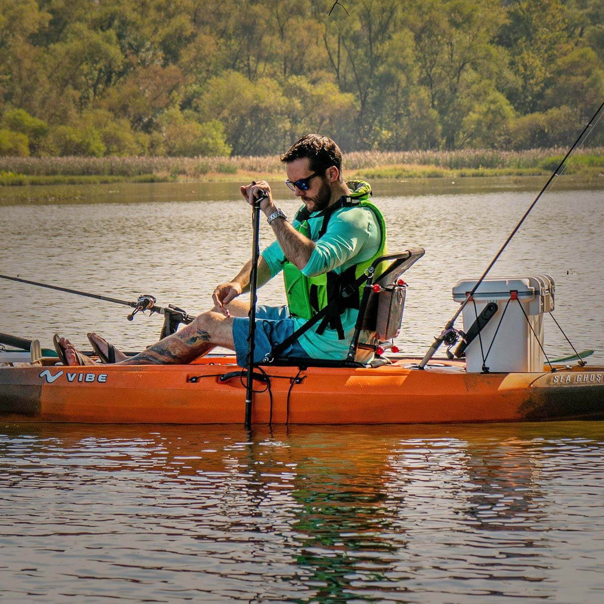 Kayak anchored in shallow water with Vibe fiberglass pole 