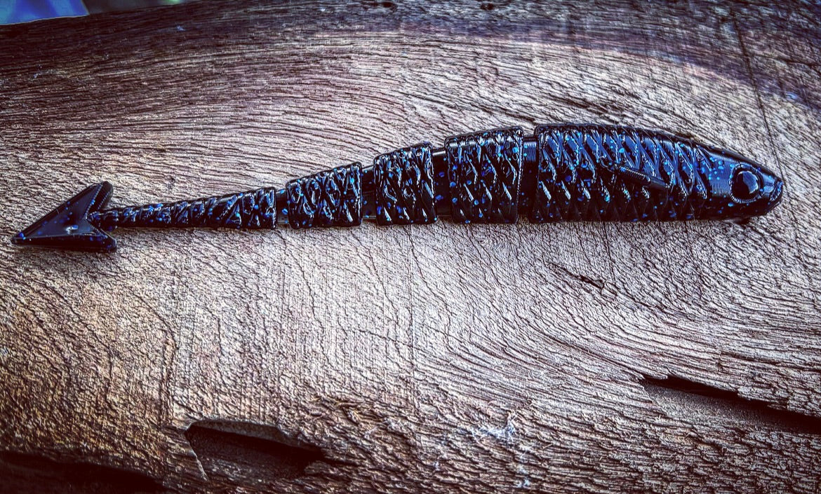 Soft Plastics Fish or Die Bait Co. Warbird Fluke-Style Soft Jerkbait 5.5” / Agent 711 (Black w/ Blue Flake) Fish or Die Warbird – Fluke-Style Jerkbait – Pescador Fishing Supply