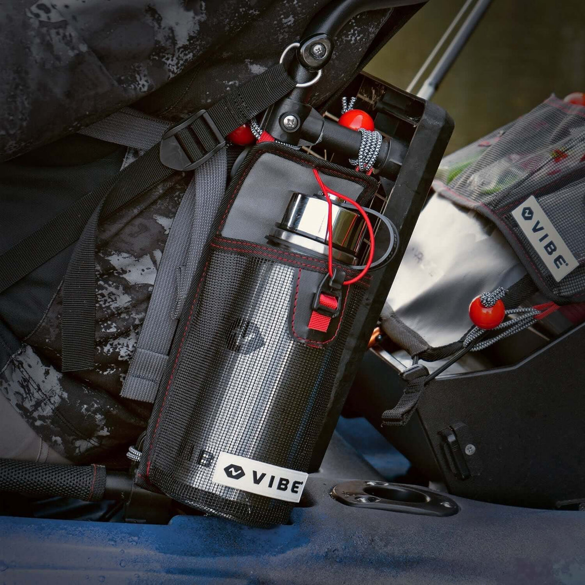 Stainless steel water bottle in mesh holder