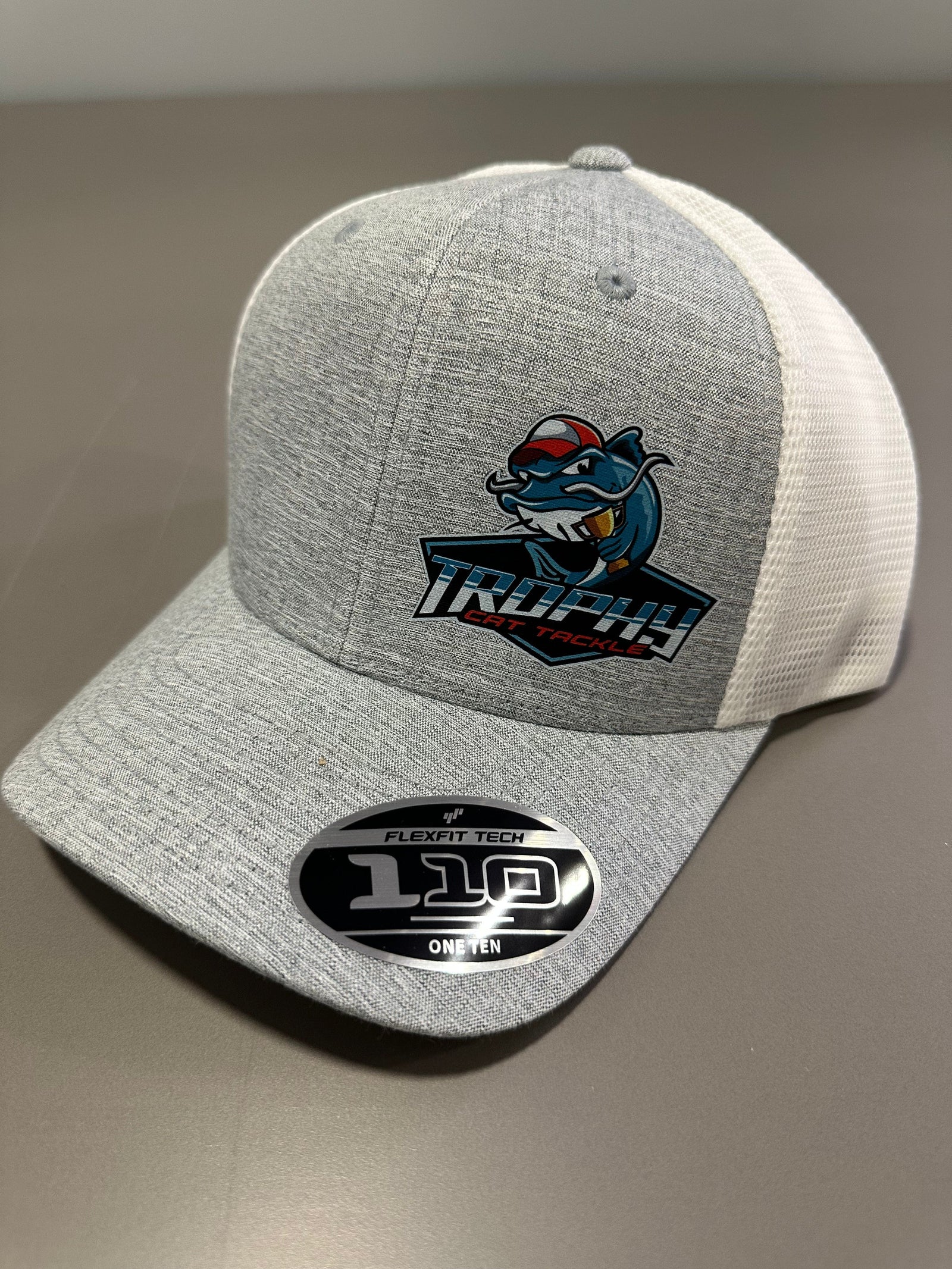 Swag Trophy Cat Tackle Heather Grey/White FlexFit 110 Snap Back Trucker Hat Trophy Cat Tackle Heather Grey/White FlexFit 110 Snap Back Trucker Hat